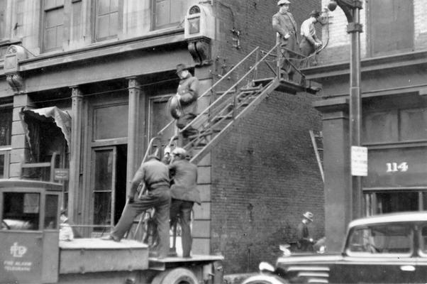 1937 Flood. Fire Department assistance. This view, photographed February 9, 1937, shows WPA men helping repair and operate emergency fire alarm systems in Louisville, KY