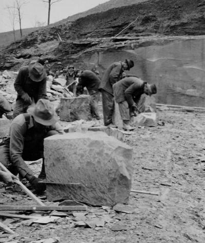 Project #583. Native stone used in construction of Hazel Green School. Another view of workmen preparing stone for construction of the Hazel Green School. Quarry may be seen in this picture. Photographed February 27, 1936