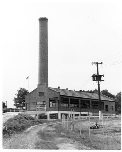 Unidentified power plant with tall smoke stack