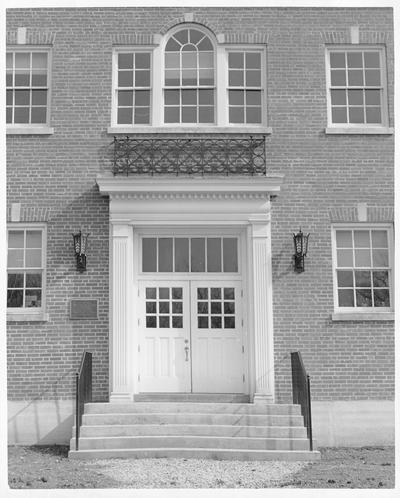 Front entrance to a large, brick building
