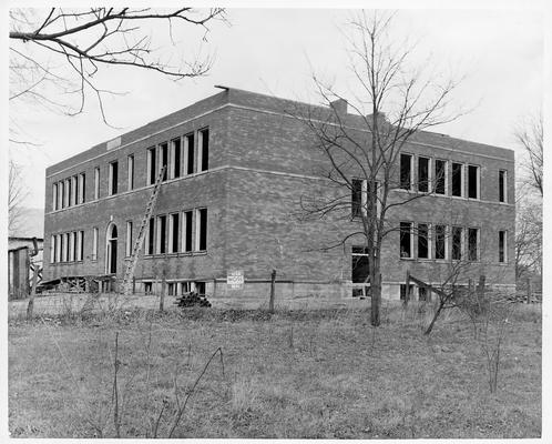 Large. brick building under construction with WPA sign