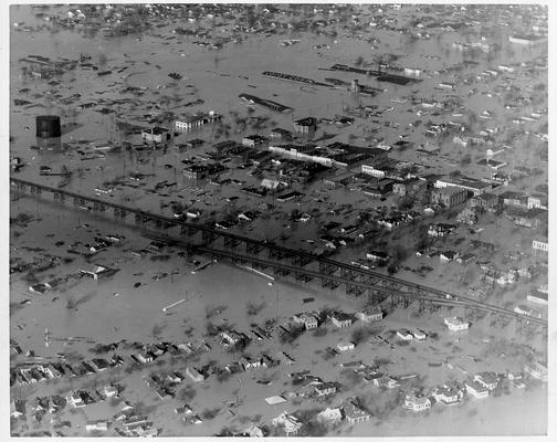 Ohio River flood stage, U.G. 57.1 feet, at Jeffersonville, IN., 1/27/37. View showing Jeffersonville completely inundated. Note the business section to the right with some factory roofs just out of the water