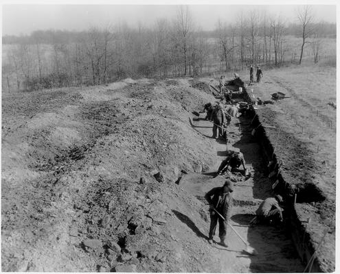 Men working in a deep ditch