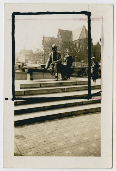 Unidentified man and woman next to a Lincoln statue
