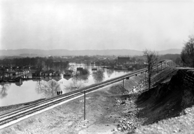 Flooded town by railroad tracks, view from above