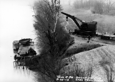 Tennessee River bridge, derrick unloading cars form barge