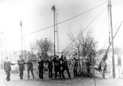 Hoisting a signal near Southern station in Lexington