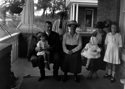 John Dicker and family on porch