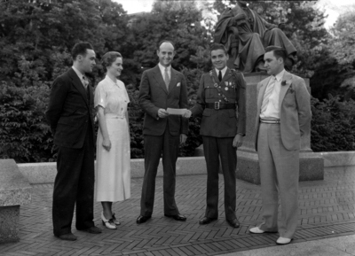 Alumni Association officials, left to right, two unidentified persons, Governor Keen Johnson (1939 - 1943), Elvis Starr, Class of 1936, and an unidentified person