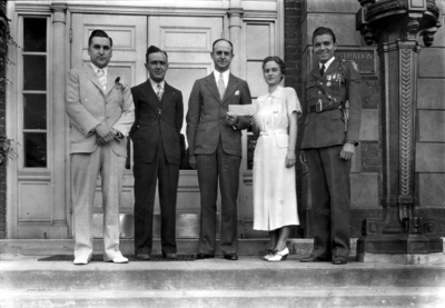 Alumni Association officials, left to right, two unidentified persons, Governor Keen Johnson (1939 - 1943), an unidentified person, and Elvis Starr, Class of 1936