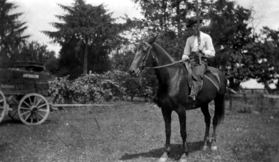 Unidentified man on horseback with shotgun