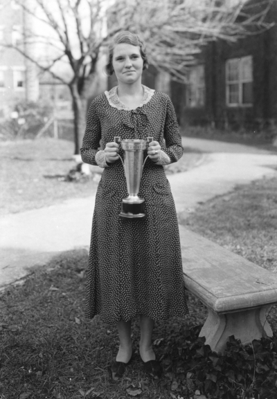 Young woman with trophy