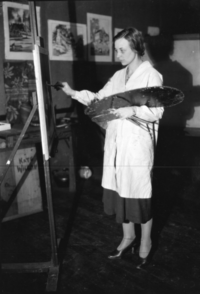 Woman artist painting, possibly Joy Pride