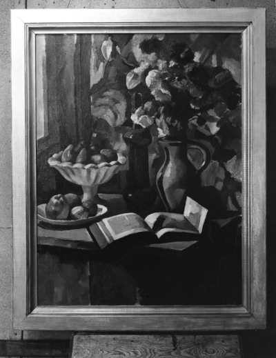 Still life of flowers in vase, fruits, pitcher and book displayed on table