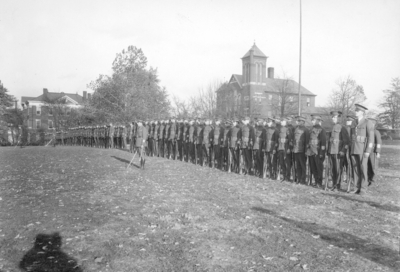 Military unit at attention, Barker Hall in background