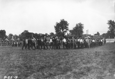 Men marching with rifles