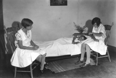 Girls playing nurses, patient