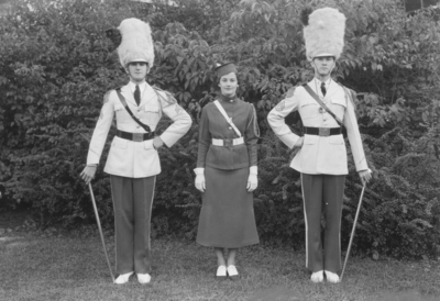 One woman and two men, drum majors
