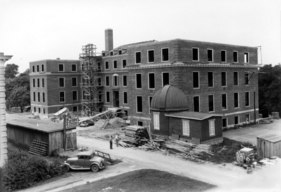 Construction of McVey Hall with the first observatory (wooden) on campus