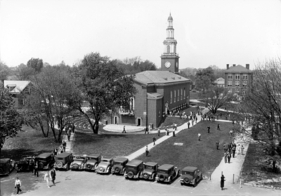 Memorial Hall exterior, east side (amphitheater) with cars and people