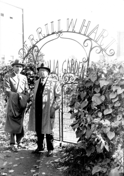 Terrill Hart (?) and Professor James Thomas Cotton Noe at the entrance to the Terrill Hart Dahlia Garden