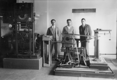 Three students with machine