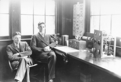 Two men at amateur radio station (Russell, Lee Penn?)