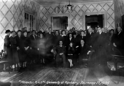 Group at Maxwell Place seated on couch from left to right, Governor A. B. 