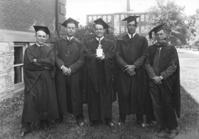 Five men in Commencement gowns