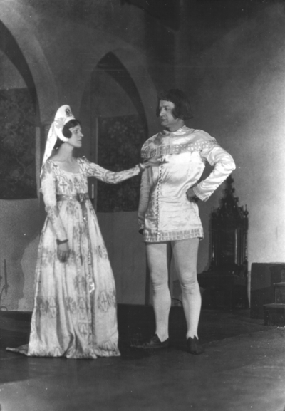 Actors in medieval costume performing in 