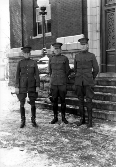 Three men in uniform