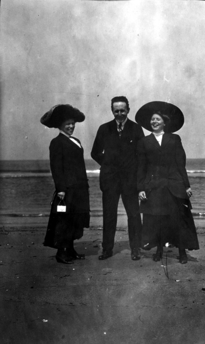 Engineering (class of 1910) trip to Norfolk, man and two women on the beach
