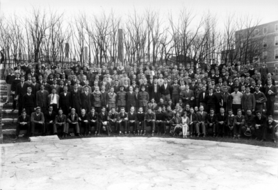 Large group photograph, steps of amphitheater behind Memorial Hall