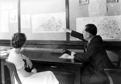 Man and woman looking at map of Kentucky
