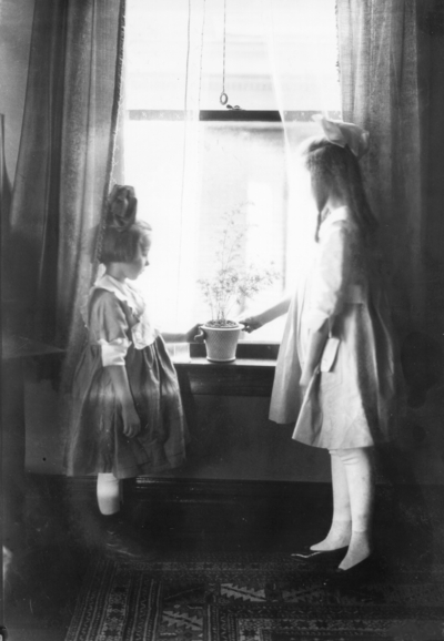 Two girls at a window
