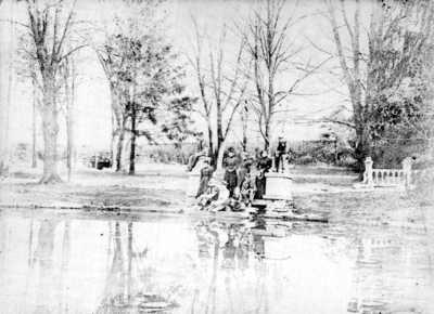 Unidentified people by the lake