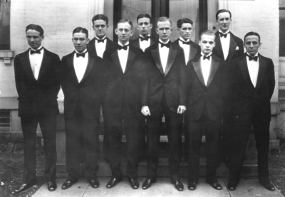 Group photograph, unidentified men in tuxedos, looks like Sigma Alpha Epsilon house on South Limestone