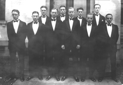 Group photograph, unidentified men in tuxedos, looks like Sigma Alpha Epsilon house on South Limestone