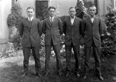 Four unidentified men in suits