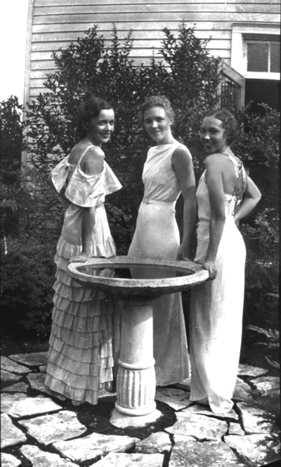 Three women by a fountain