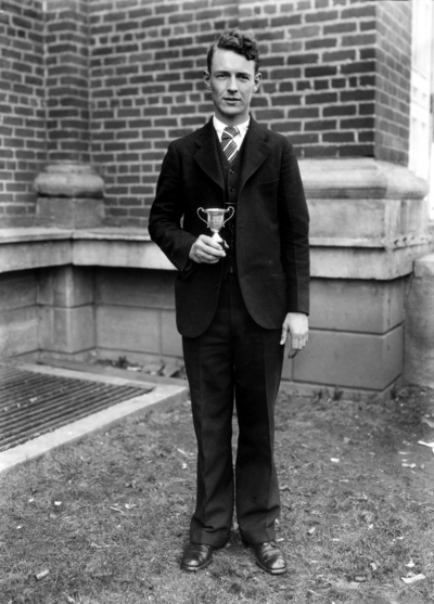 Unidentified man with trophy, intramural sports