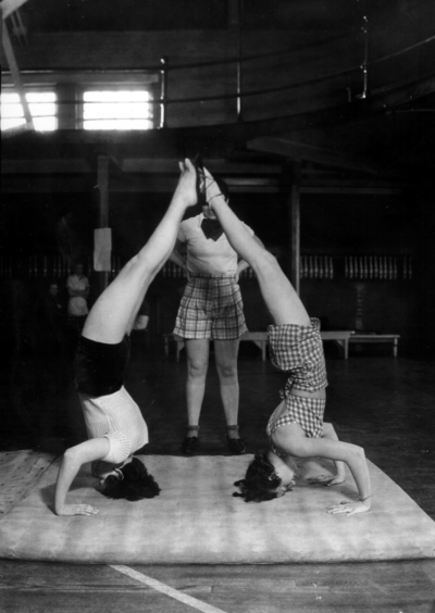 Practicing headstands in class