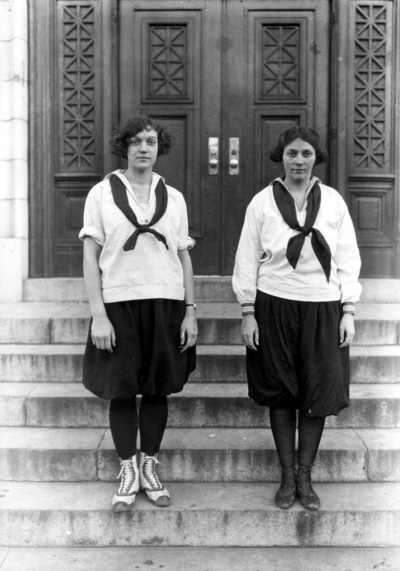 Two members of women's basketball team, Sarah G. Blanding, Dean of women, on right