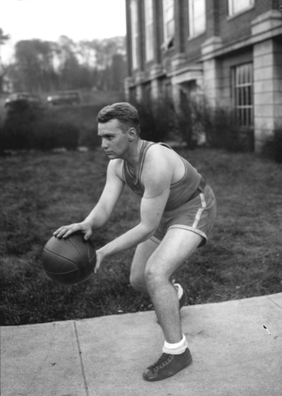 Basketball player, Bill Kleiser? in front of Alumni Gym, 1930-1931