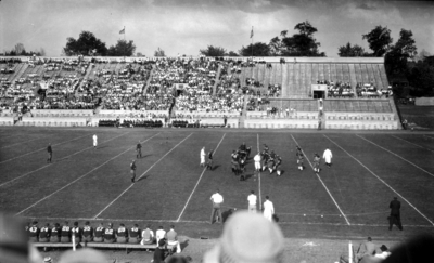 Football game, field and stands, (Stoll Field and McLean Stadium)