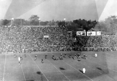 Football game, field and stands, (Stoll Field and McLean Stadium)