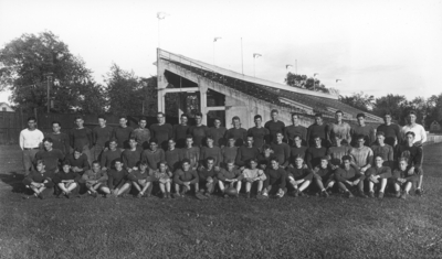 Kentucky football team in front of stands of McLean Stadium