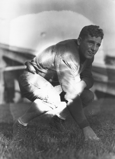 Kentucky football player, in three point stance position