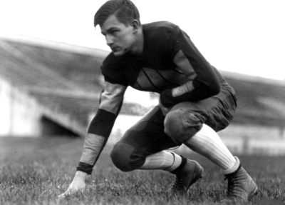 Kentucky football player in three point stance