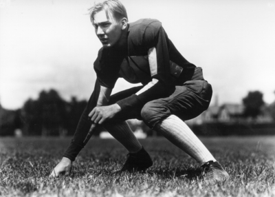 Kentucky football player in three point stance